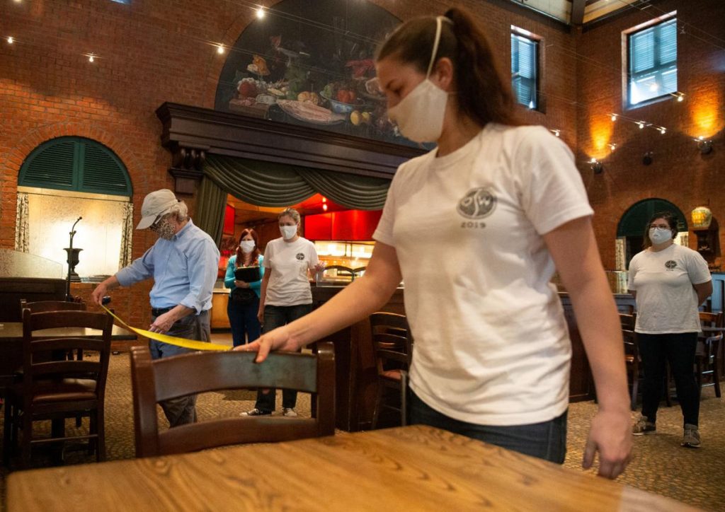 Employees measuring tables