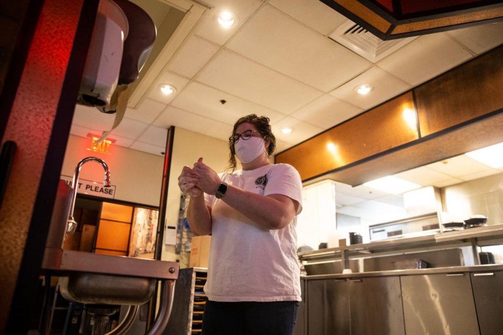 Employee washing hands